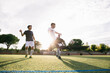 © Inuk Studio/Stocksy - Football players playing football on field