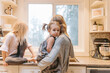 © LUKE LIABLE/Stocksy - Kids making breakfast in the morning
