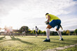 © Inuk Studio/Stocksy - Group of men playing football