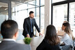 © AntonioDiaz - Businessman discussing new ideas with coworkers during a meeting