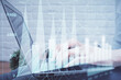 © peshkova - Multi exposure of woman hands typing on computer and forex chart hologram drawing. Stock market analysis concept.