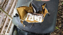 Top View Of Old Ripped Motorcycle Cushion Seat, Damaged From Prolonged Use