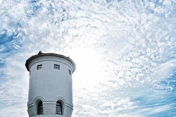 Wall Mural - blue sky with clouds and old water tower landscape. Abstract background. Vintage architecture. Natural color of sky