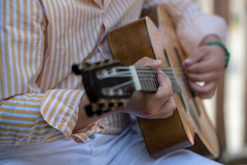 Wall Mural - detail of a classical guitar player