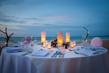 Wall Mural - Set the table for dinner on the beach.