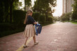 © Алина Бузунова - Back to school. Little girl from elementary school outdoor. Kid going learn new things 1th september