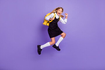Wall Mural - Full length body size view of her she nice attractive cheerful crazy overjoyed small little girl jumping running late lesson isolated bright vivid shine vibrant lilac violet purple color background