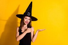 Portrait Of Her She Nice-looking Attractive Pretty Cute Content Cheerful Lady Wizard Holding On Palm Showing Copy Space Advert Solution Isolated On Bright Vivid Shine Vibrant Yellow Color Background