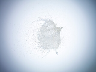 Exploding water balloon on white background