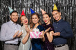 © Syda Productions - celebration, fun and holidays concept - happy friends in party hats with birthday gift applauding