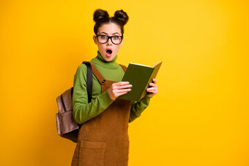 Poster - Portrait of her she nice attractive stunned wondered intellectual girl nerd reading interesting book novel science fiction isolated bright vivid shine vibrant yellow color background