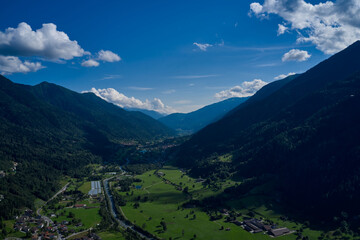 Panorama of beautiful countryside of Italy. Grassy field and rolling hills. Sunny afternoon. wonderful springtime landscape in mountains. Rural scenery