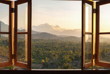 View From The Window To The Fields And Mountains At Sunset. View From The Hotel Window In The North Of Bali