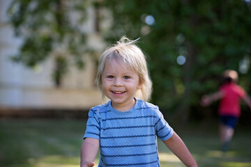 Poster - Child, toddler boy, playing in the park, running happily