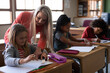 © Wavebreak Media - Female teacher teaching a girl in the class at school