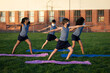 © Wavebreak Media - Group of kids wearing face masks performing yoga in the garden