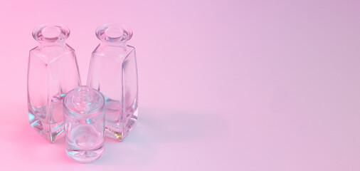 Wall Mural - concept with two shaped square-bottom and one cylindrical round-bottom crystal clear clean empty gla