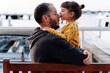 © gemma ferrando & jeremie roman/Westend61 - Father embracing while daughter kissing him on nose in city