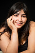 © Fernanda - Portrait Hispanic woman smiling looking at camera on black background - inclusive beauty- curvy woman - body positive character, feminism, self love, beauty concept