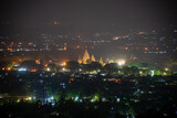Fototapeta Miasto - The view of Prambanan temple at night from a hill. Shot using special technique