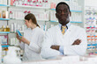 © JackF - Male pharmacist ready to serve clients in a modern pharmacy