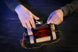© Pixel-Shot - Man defusing bomb at table