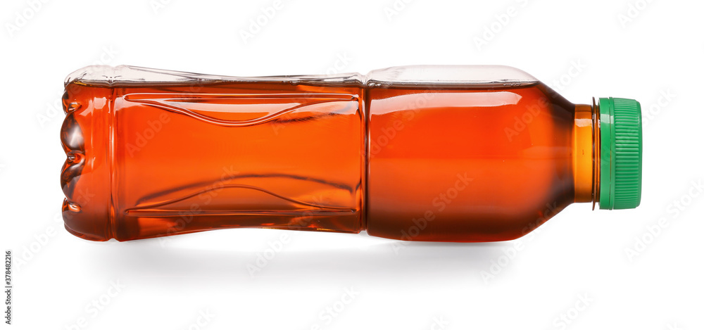 Bottle of fresh ice tea on white background