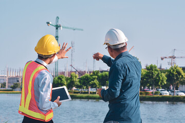 Wall Mural - Engineering holding tablet work on site construction