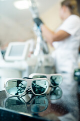 Safety glasses for laser hair removal and hardware teeth whitening procedures in a beauty salon
