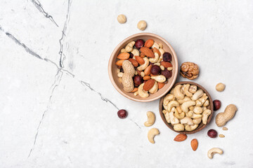 Bowls with nuts mix as snack or ingredient for tasty dessert, meal