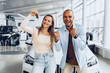 © fotofabrika - Happy excited couple buying a new car and showing keys