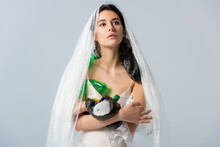 Young Woman With Plastic Bag On Head Standing In Silk Dress With Empty Bottles Isolated On Grey, Ecology Concept