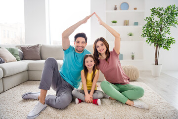 Sticker - Full size photo of positive three people mommy daddy small kid girl make hands roof enjoy loan house sit comfort carpet floor in living room indoors