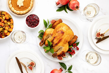 Turkey or chicken served with light white wine for festive dinner, top down view