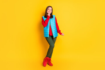 Canvas Print - Full body size photo of pretty cute young lady dreamy look empty space hand chin smiling girlish posing wear green pants blue vest red sweater boots isolated bright yellow color background