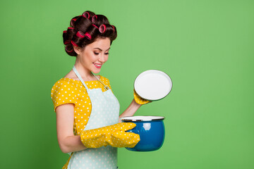 Sticker - Turned photo of positive cheerful girl open cover saucepan look enjoy organic soup wear yellow pot holder dotted stylish trendy skirt dress hair rollers isolated green color background