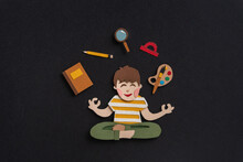 Schoolboy Sitting In Lotus Pose With Education Supplies. Funny Paper Illustration