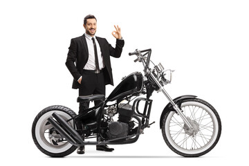 Sticker - Man in a black suit standing with a chopper motorbike and gesturing ok sign