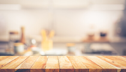 Wall Mural - Wood texture table top (counter bar) with blur cafe, kitchen background