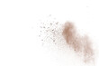 © piyaphong - Brown powder explosion isolated on white background.