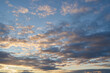 © nikolay_alekhin - Beautiful evening blue sky at sunset with flaming bright light clouds. A warm summer evening at sunset.