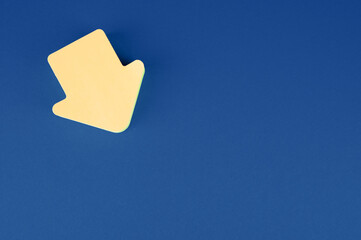 Closeup shot of an arrow point to the right icon isolated on blue background