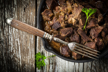 Wall Mural - Beef stew in a cast iron skillet.