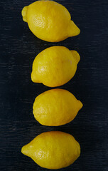 Poster - lemons on dark wooden surface