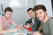© auremar - portrait of three male students sat at desk