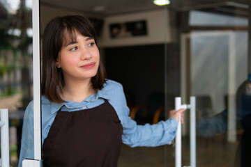 Lovely latin female entrepreneur looking at the street in front of store facade. business, workplace, successful, entrepreneur, occupation concept..