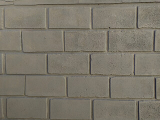 
gray wall background with bricks in horizontal format