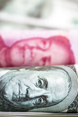 Macro of dollar bills and China yuan or Renminbi banknotes, Chinese and US economy finance commercial business, money closeup