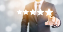 Hand Of Businessman Touching Five Star Symbol To Increase Rating Of Company Concept