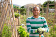© JackF - Portrait of skillful Colombian gardener with hoe during spring works at his smallholding